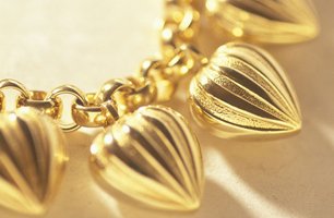 Gold heart charms on a bracelet