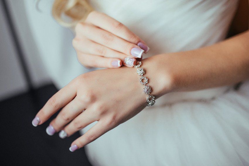 Diamond bracelet worn with a wedding dress